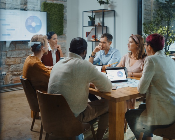 Diverse Team of Professional Businesspeople have Meeting in the Modern Office Conference Room. Ambitious, Creative Start-up Entrepreneurs Discuss Analysis Data, App Design, Product Concept.